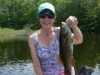 woman in shorts with bass from East Grand Lake