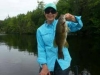 lady in blue with bass from East Grand Lake