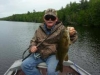 man in green with bass from East Grand Lake